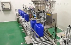 Automated volumetric filling machine for inkjet ink bottles and containers.